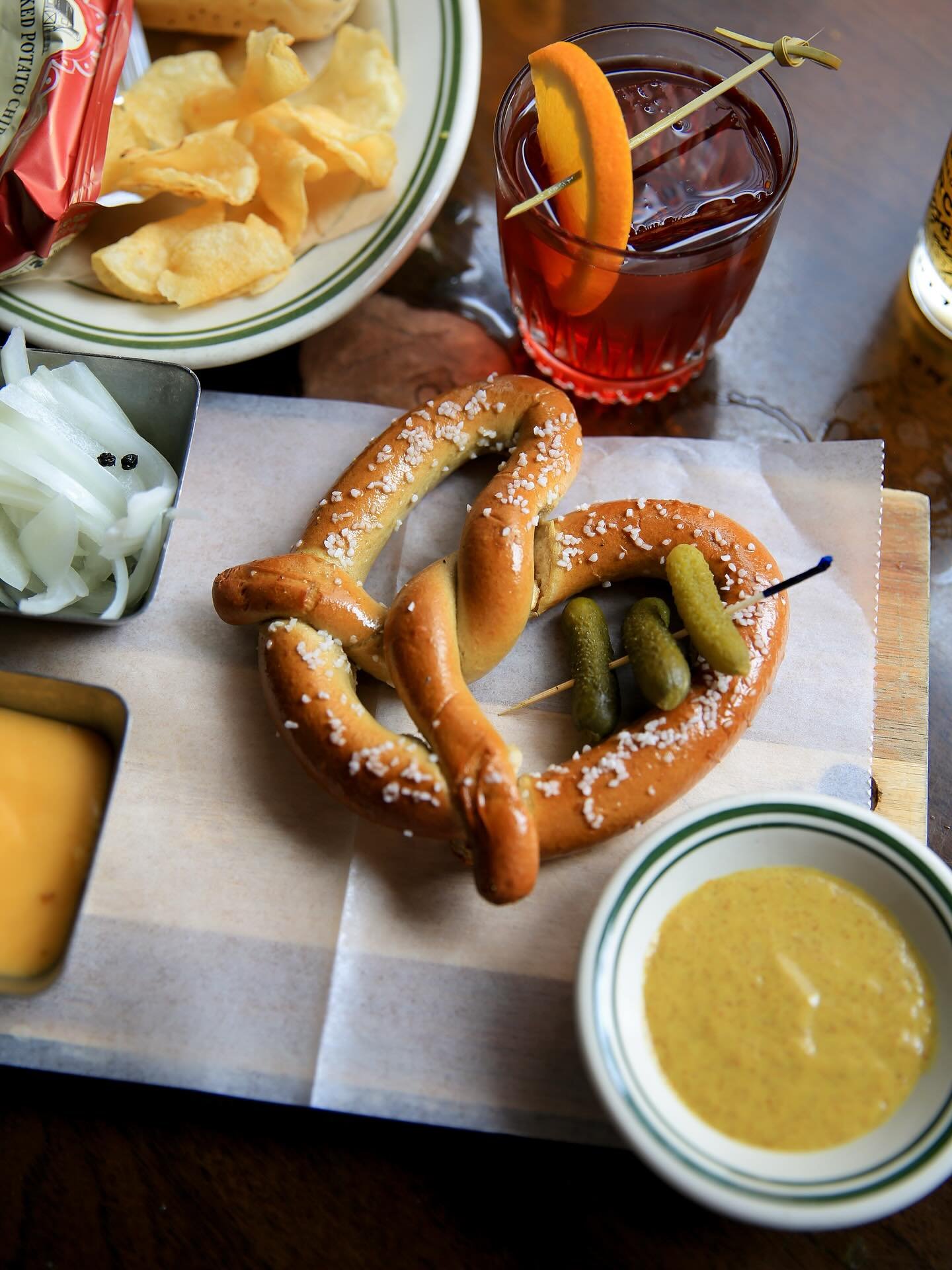 Join us for Happy Hour 🍻 and don&rsquo;t slip on ordering one of these 🥨 | every Monday - Friday, 4 - 7 pm