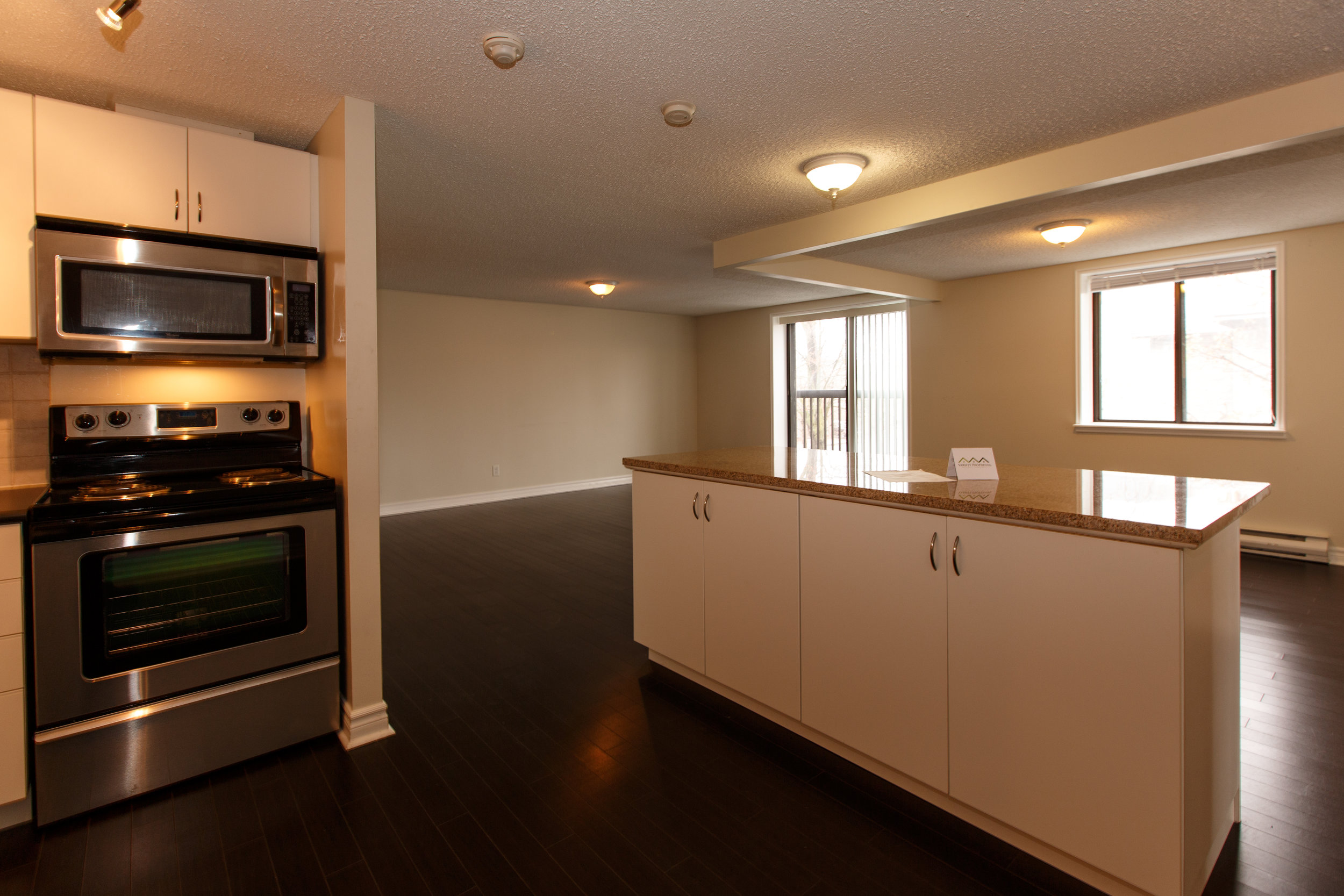 311 Queen St. _u007c_ Kitchen Photo, looking towards living room area.jpg
