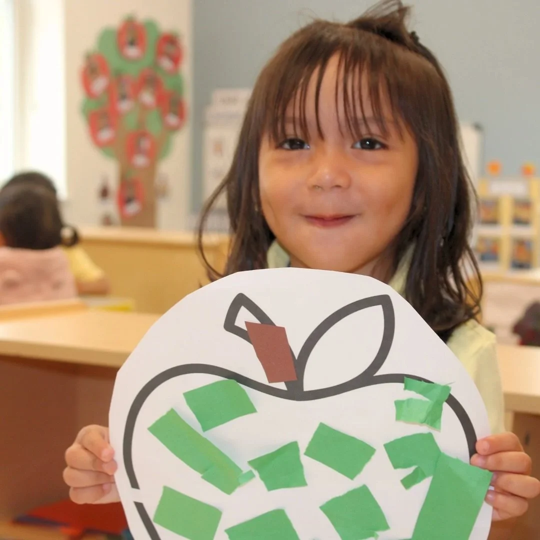 Room 5 has been learning all about apples this week! Our young preschoolers strengthened their fine motor skills by ripping and gluing paper to make colorful apples. They learned about the different colors apples can be and showed off their creativit