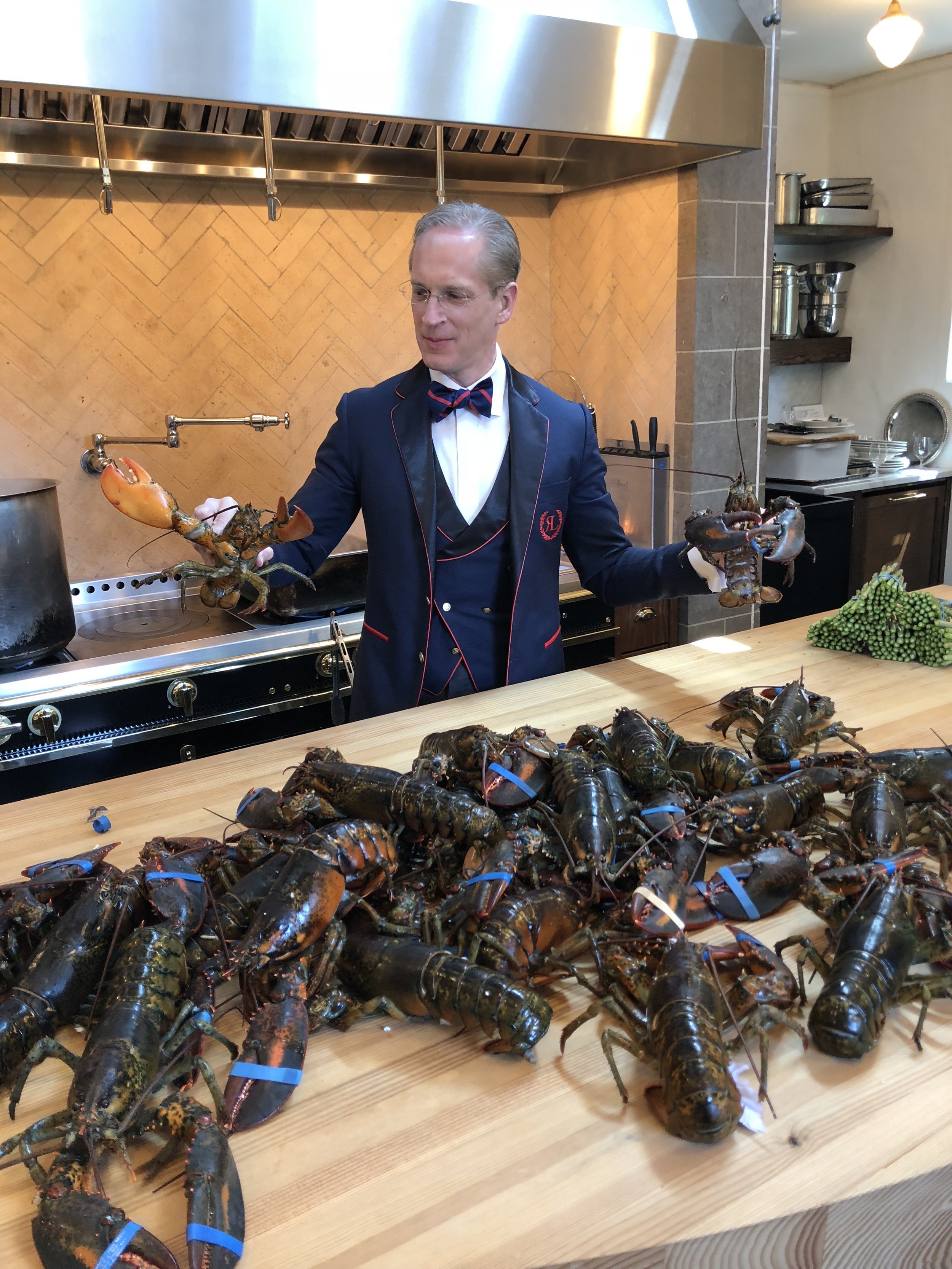 Leland in the Kitchen with Lobsters.jpg