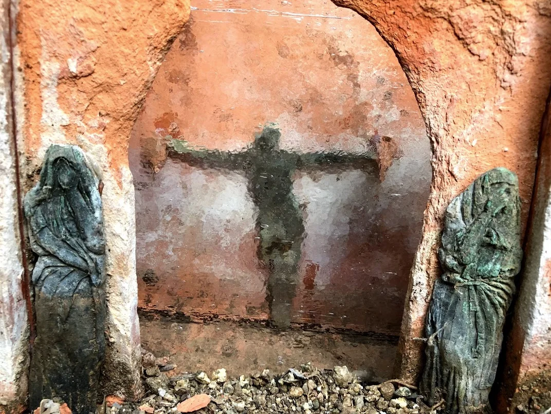 Renovation at the chapel in the wall. The art glass appears water-like onto the brass statue inside.
