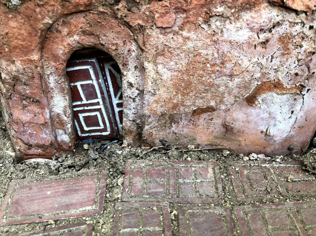 These old walls crumble after decades of exposure to Nature. Dominocchio Square.