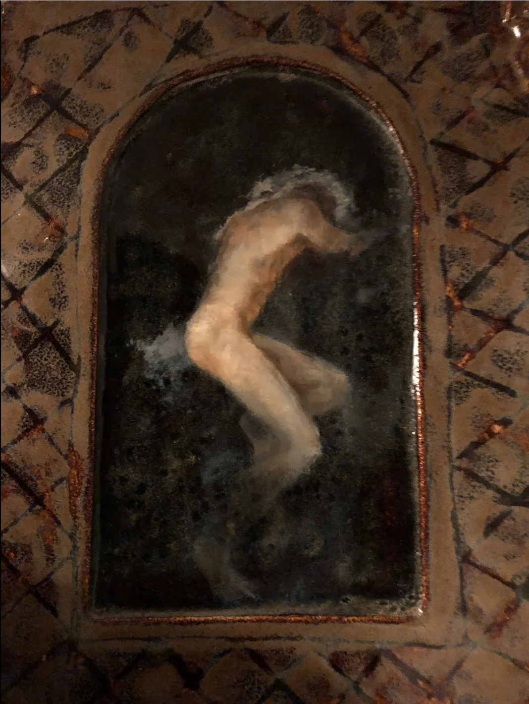 After I’d sculpted and glazed this tablet, I painted the man in oils.