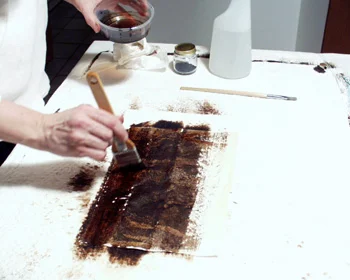 Paper completely covered with walnut ink.