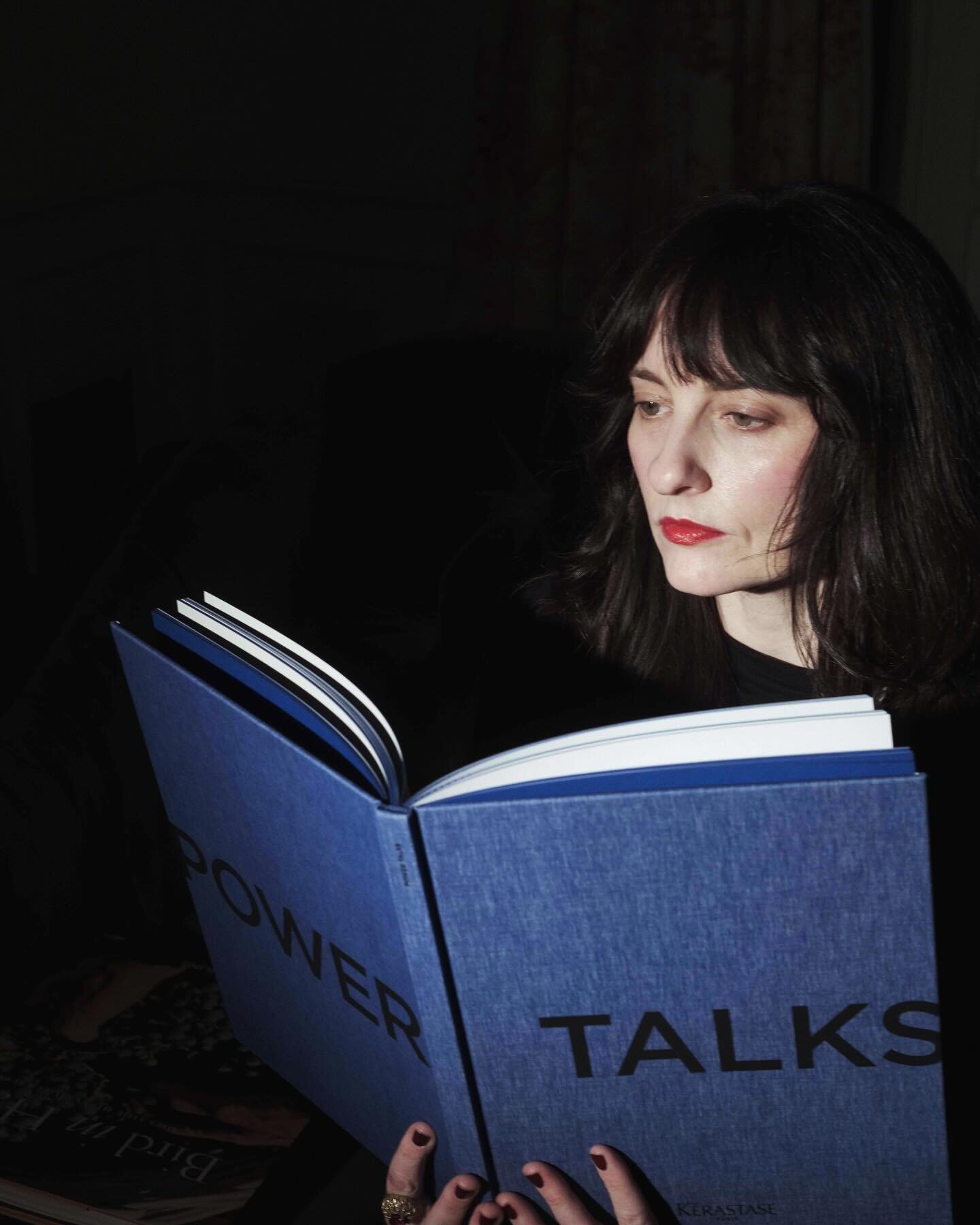 Me reading the book I edited for @kerastase_official with talks by @emrata and other powerful women from the 2022 #powertalks summit in Paris. 📷: @michaelleviton #cblackclients #beautyindustry #brandstorytelling