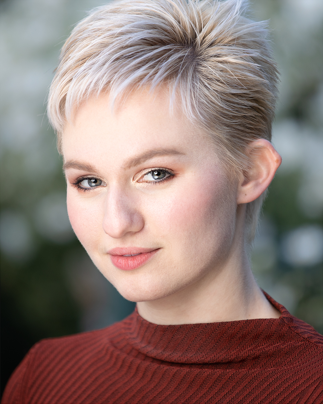 Professional headshot of a young woman with short hair in San Francisco