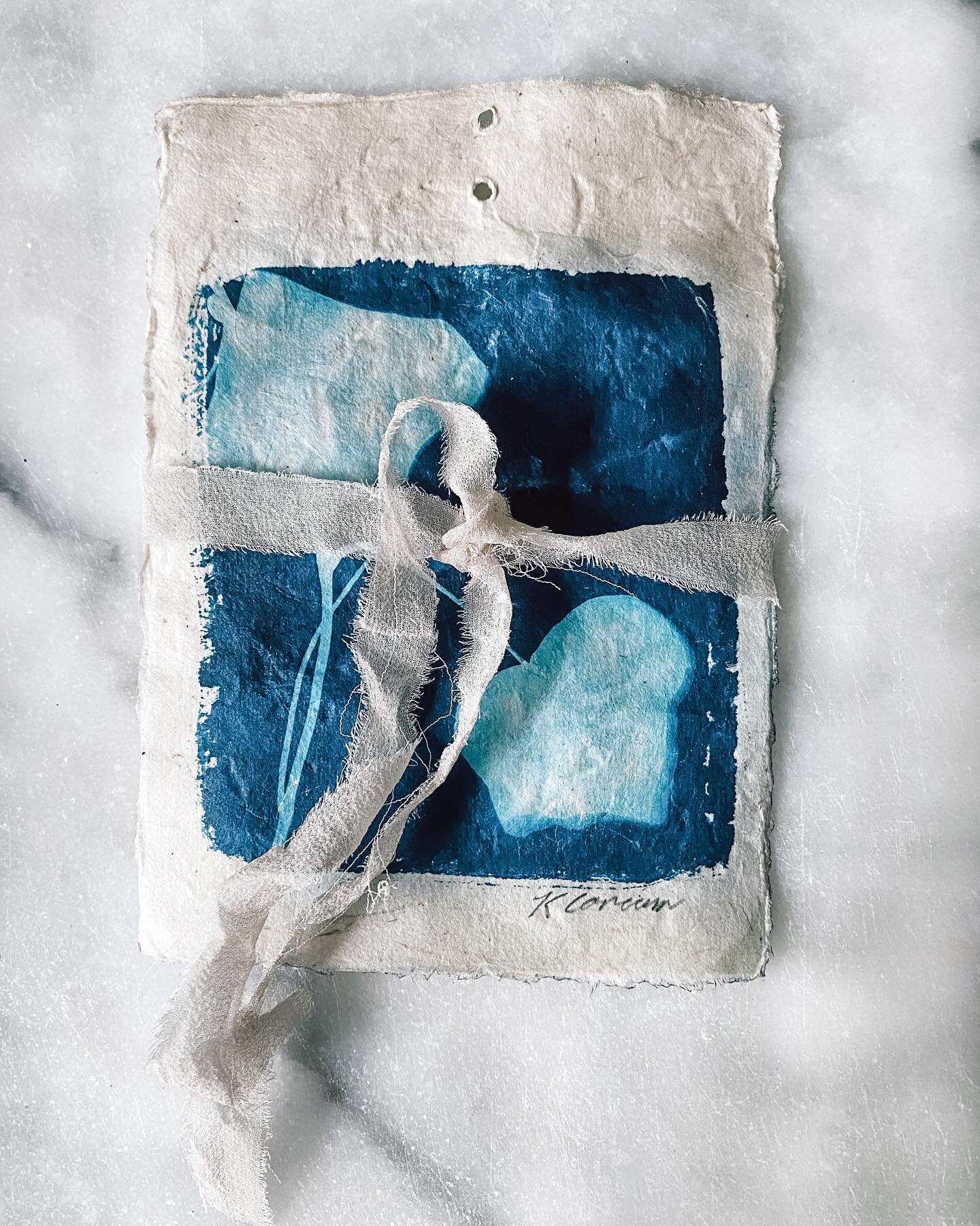 A cyanotype print all tied up in a bow, ⁣
⁣⁣
⁣a creation that still makes me smile⁣ 
⁣⁣
⁣This summer I created artwork for friends and family and they in return have given those works beautiful homes to exist in. I gave this beautiful cyanotype print
