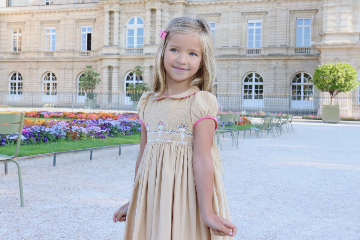 classic smocked dress playing outdoors after school, Jardin du Luxembourg, French children's fashion, Paris autumn childhood