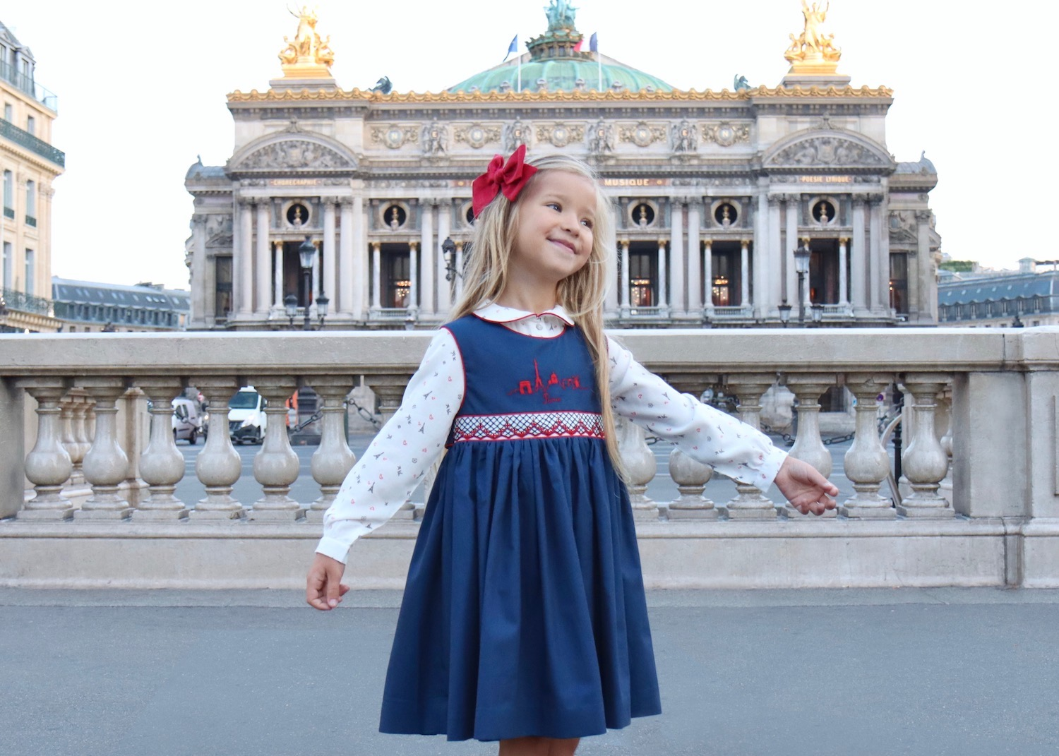 Little girl wearing a handmade French dress in Paris, French dresses for girls, Parisian children’s fashion