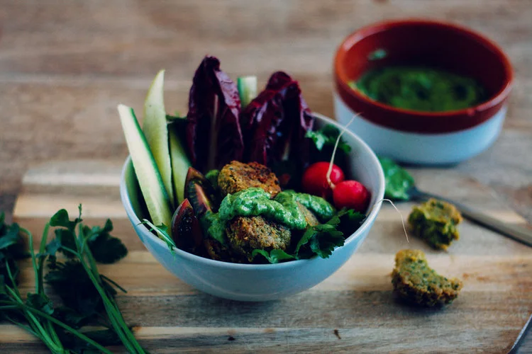 Breaded falafel in bowl with vegetables