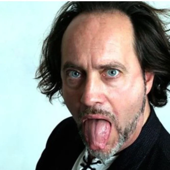11 APRIL 2019 : Standup comedian IAN COGNITO sat down and died onstage at the Atic Bar's Lone Wolf Comedy Club in Bicester, England, shortly after joking about having a stroke "and waking up speaking Welsh.” He was sixty.