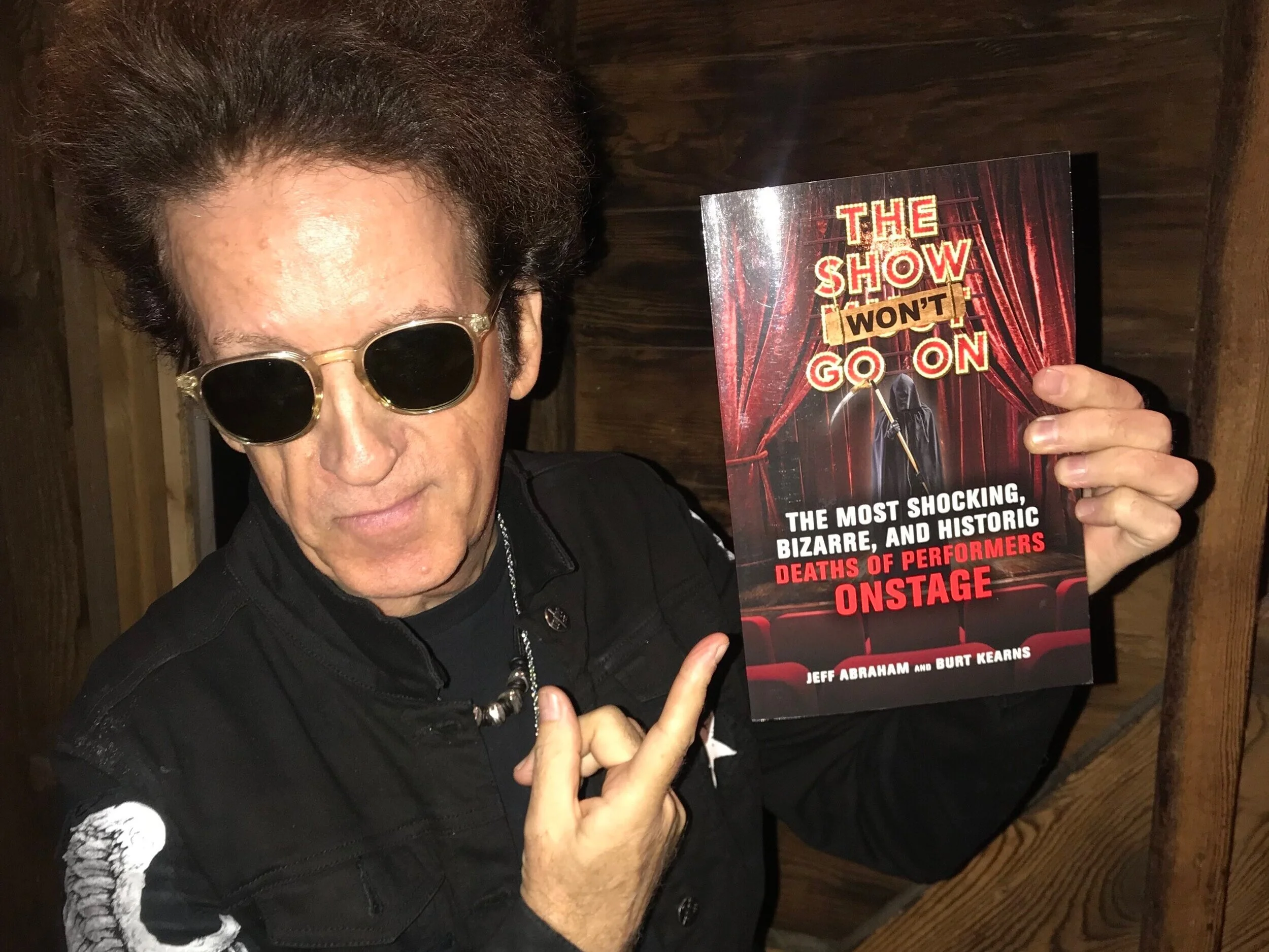 ROCK ’N’ ROLL LEGEND WILLIE NILE SHOWS OFF HIS SIGNED COPY OF THE SHOW WON’T GO ON . COINCIDENTALLY, THE SINGER-SONGWRITER, WHOSE LATEST ALBUM IS CHILDREN OF PARADISE , RECORDED THE SONG, PEOPLE WHO DIED .