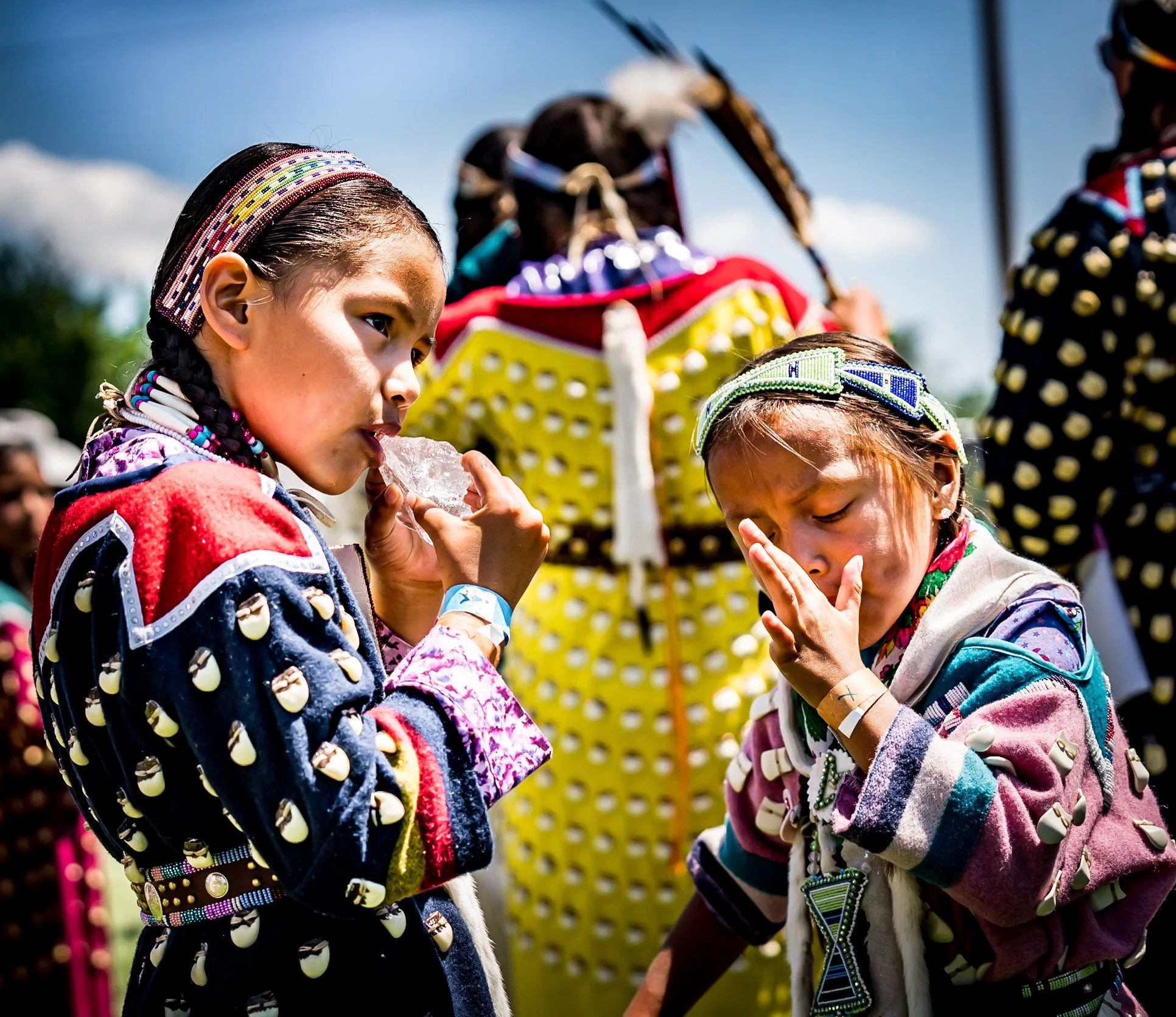 Icy Hot-Two native Girls sucking on Ice during a very Hot Pow Wow.