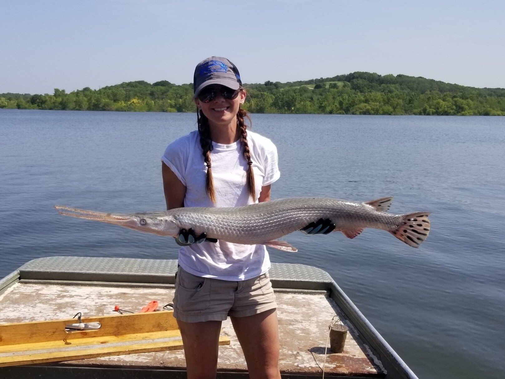  Rene with a Gar fish at Kansas State University where she us conducting her PhD. 