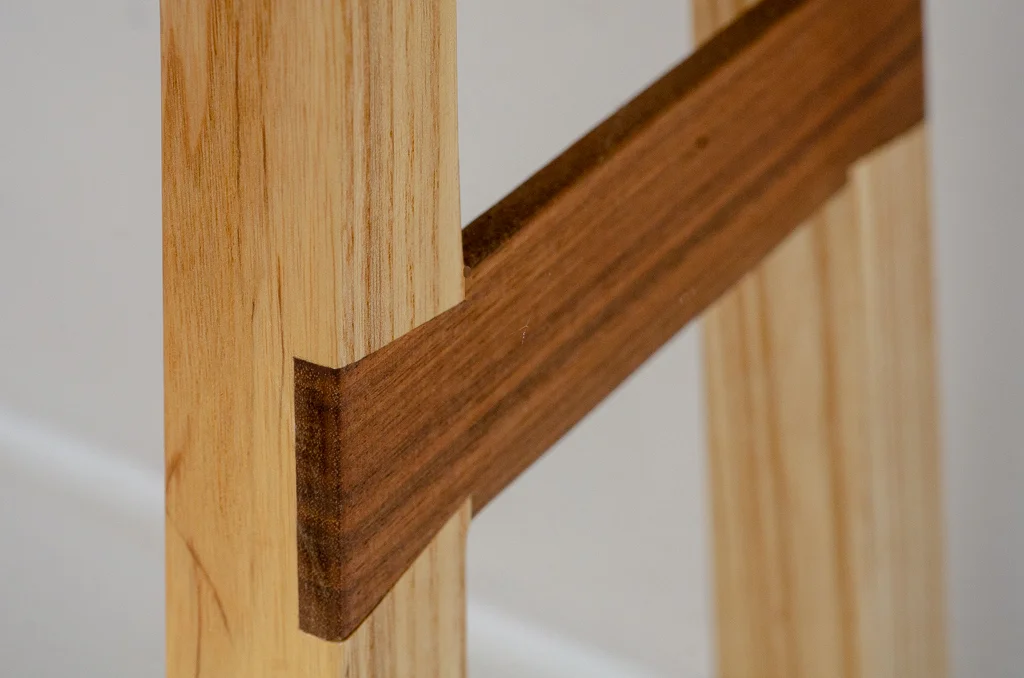 Dovetailed brace on stool leg