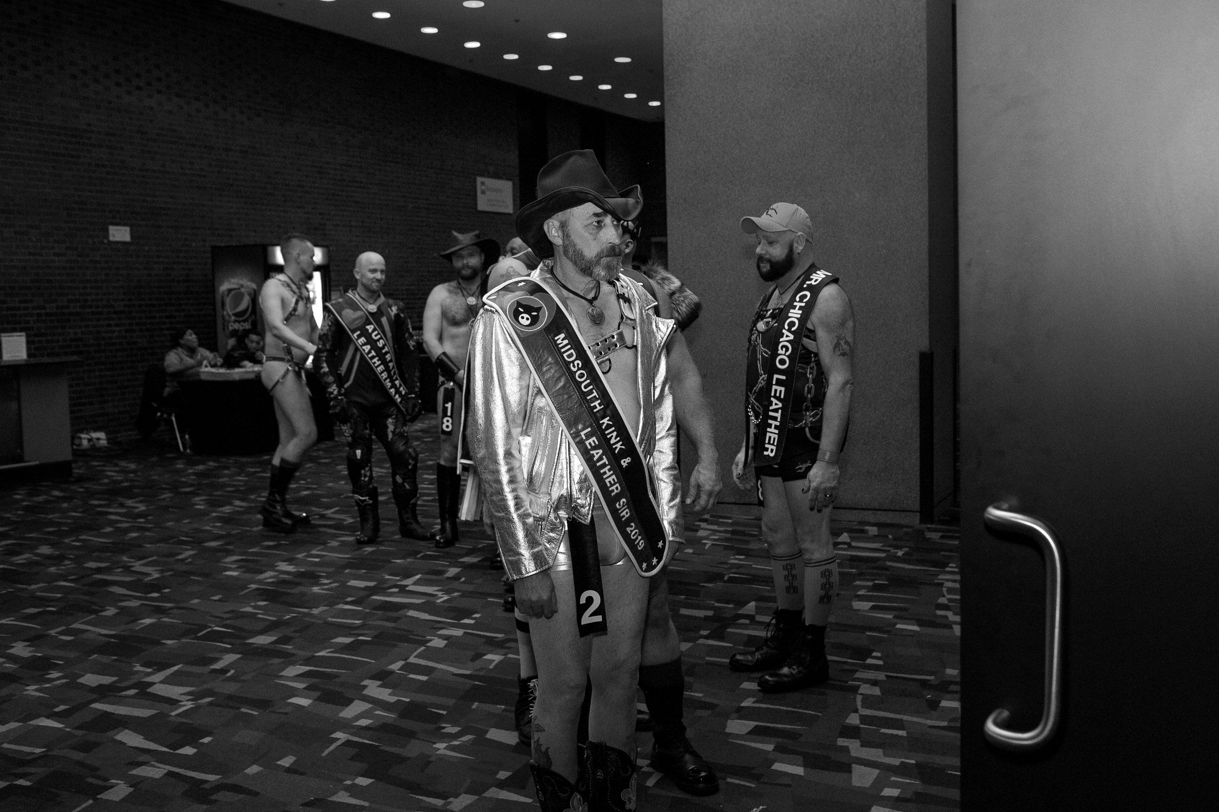  Contestant two, mr. MidSouth Kink &amp; Leather Sir. 2019, Den-Nickolas Schaeffer-Smith, peers into the open arie crown theater doors, just before opening ceremonies begin at the mccormick place theater, Saturday, may 28, 2022. 