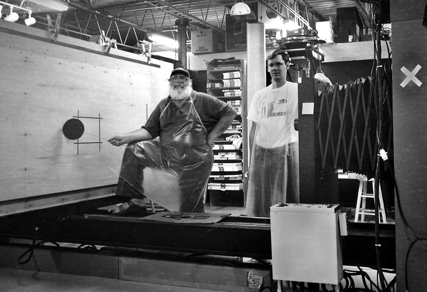 Clyde & Neal Obendorf - dkrm assistant, with Big Bertha Enlarger.jpg