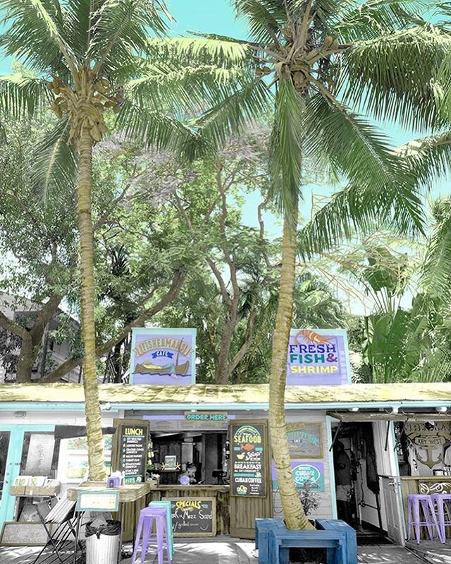 Fishermans Caf&eacute; 
Hand-painted photograph  It was a beautiful day when we strolled by this sweet little tropical restaurant located near Old Town and the Historic Seaport of Key West. The smell of fresh cooked fish was too much to resist, so we