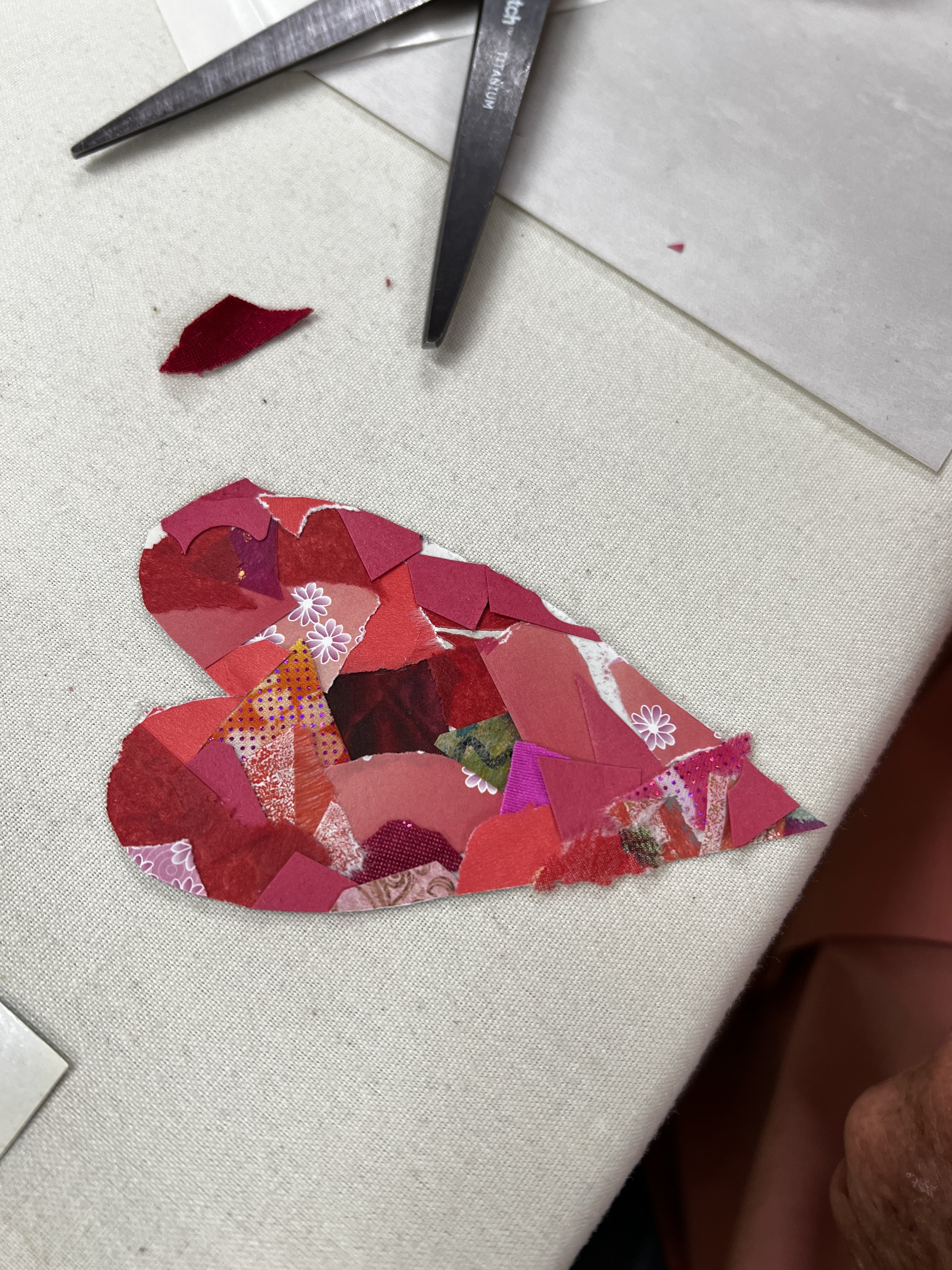 Pink paper collage in the shape of a heart