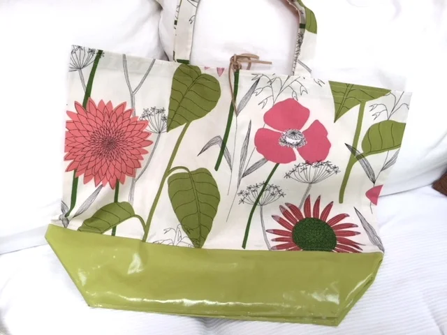 A cute beach bag made from FabMo fabric and a water resistant bottom. Perfect for a day on the beach.