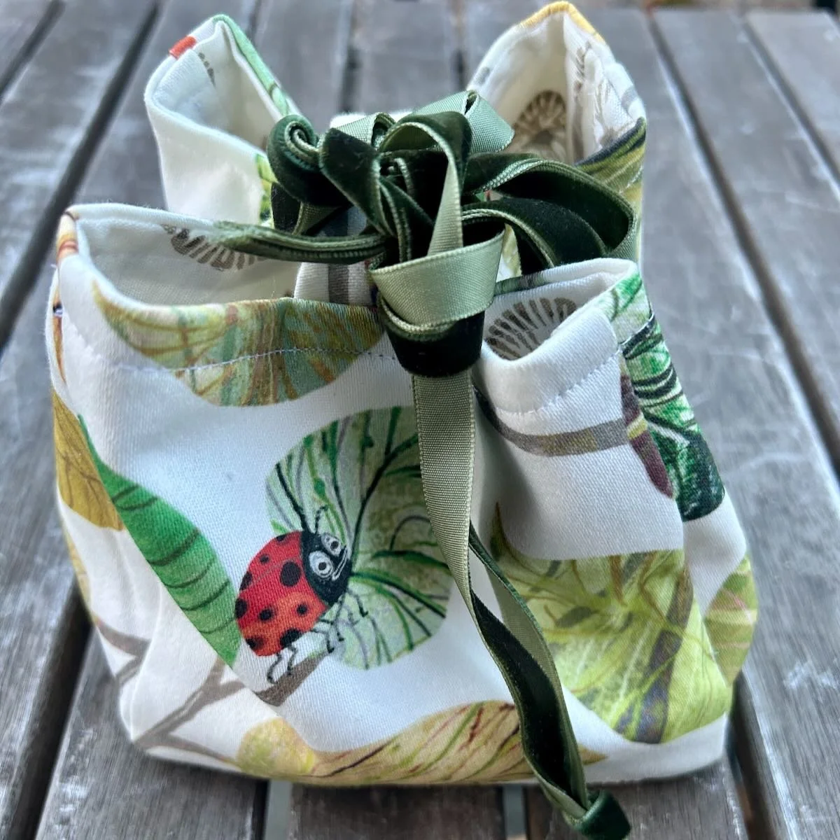 Handmade rice bag made with fabric with ladybug and leaves design