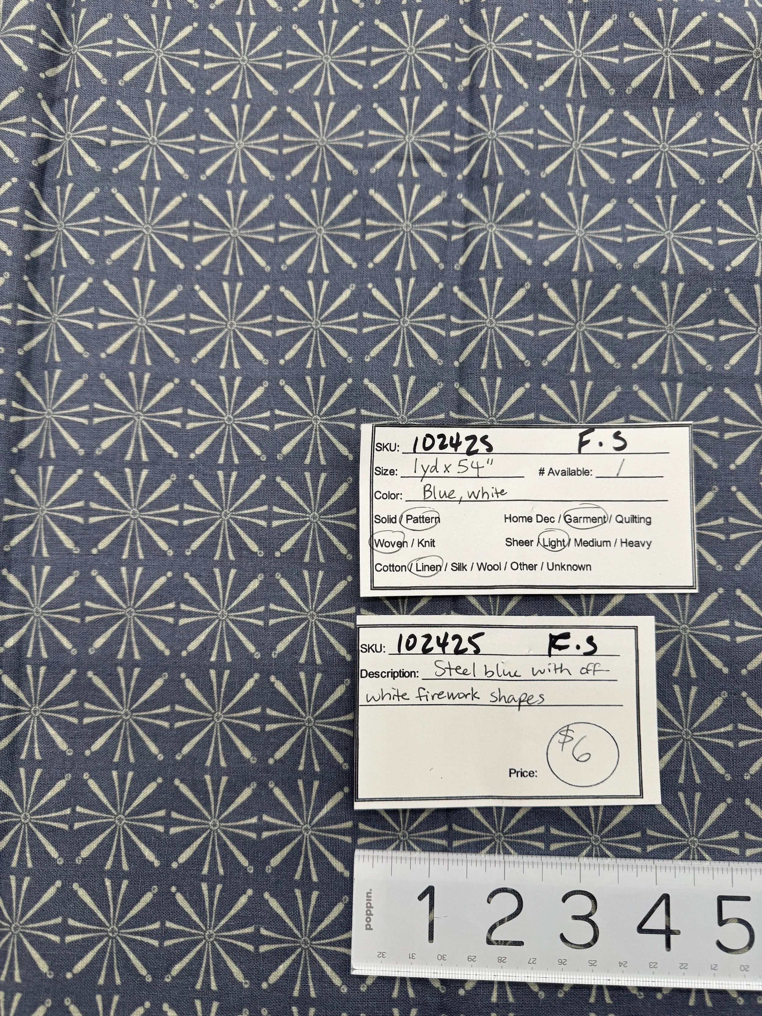 102425-F-S White firework-like shapes on blue; Linen; 1 yd x 54"