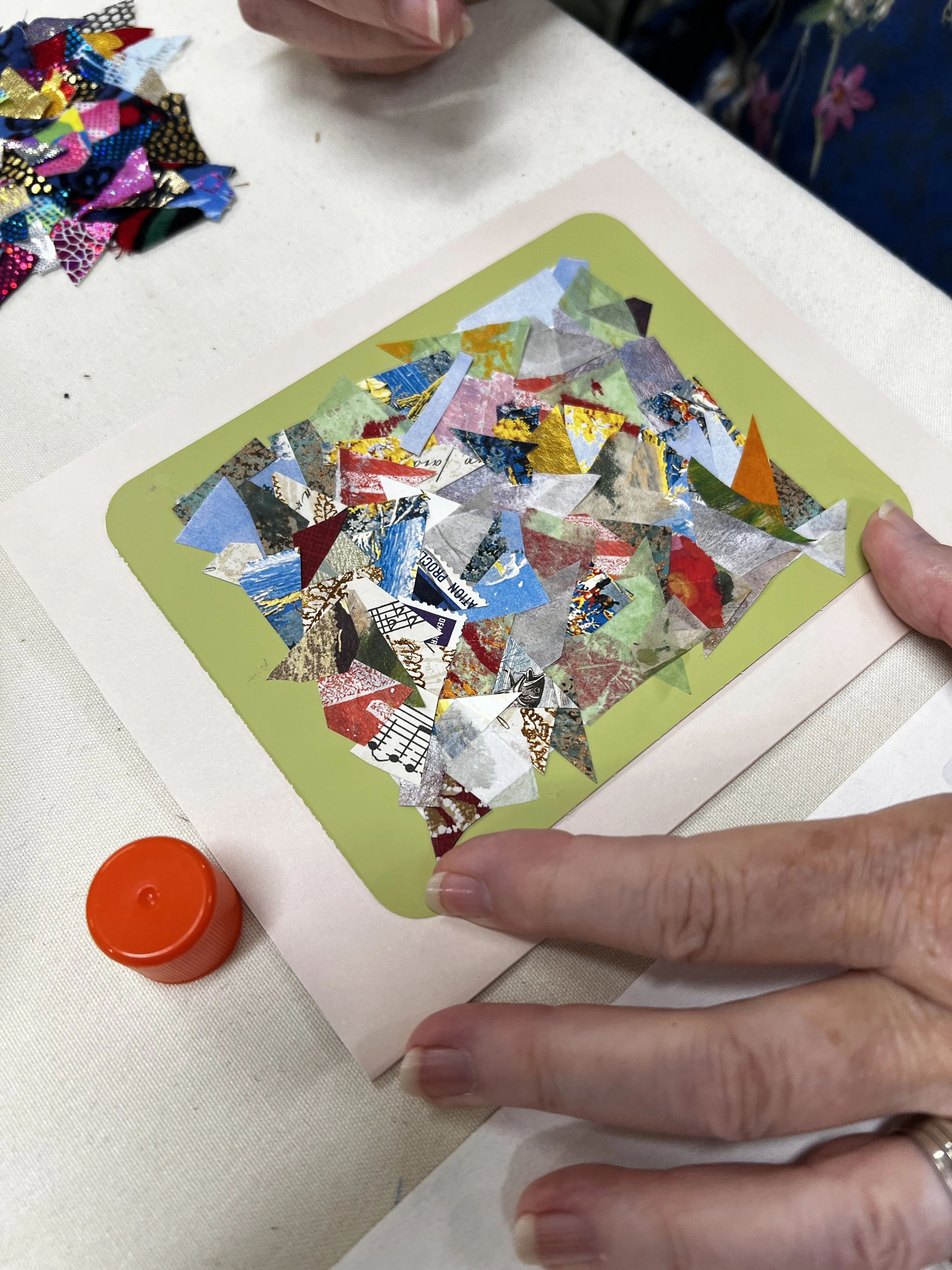 Colorful paper collage greeting card on green background