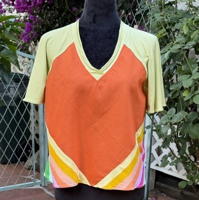 Yellow T-shirt with orange panel and multicolored stripes