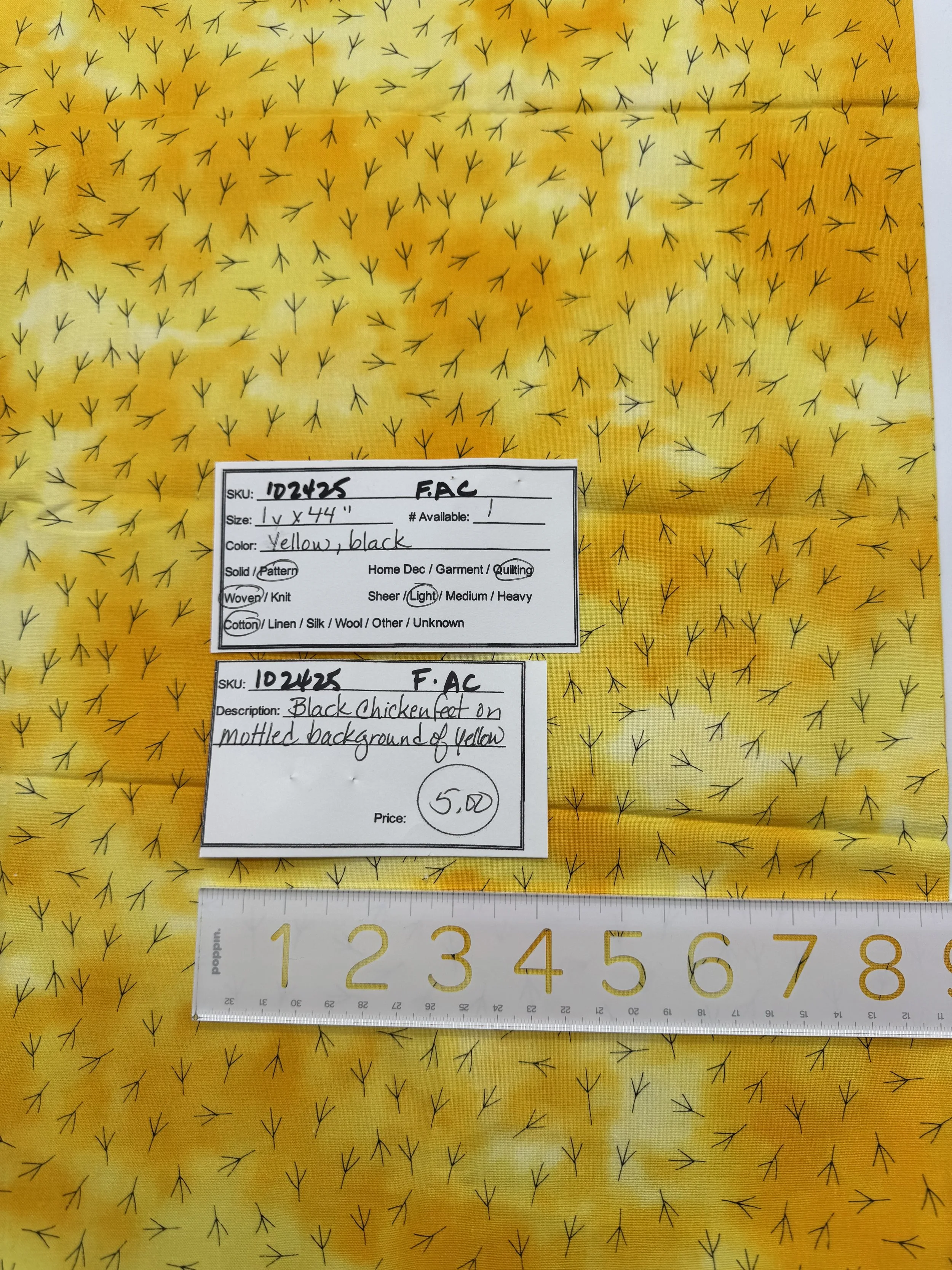 102425-F-AC Black chicken feet on yellow; Cotton; 1 yd x 44"