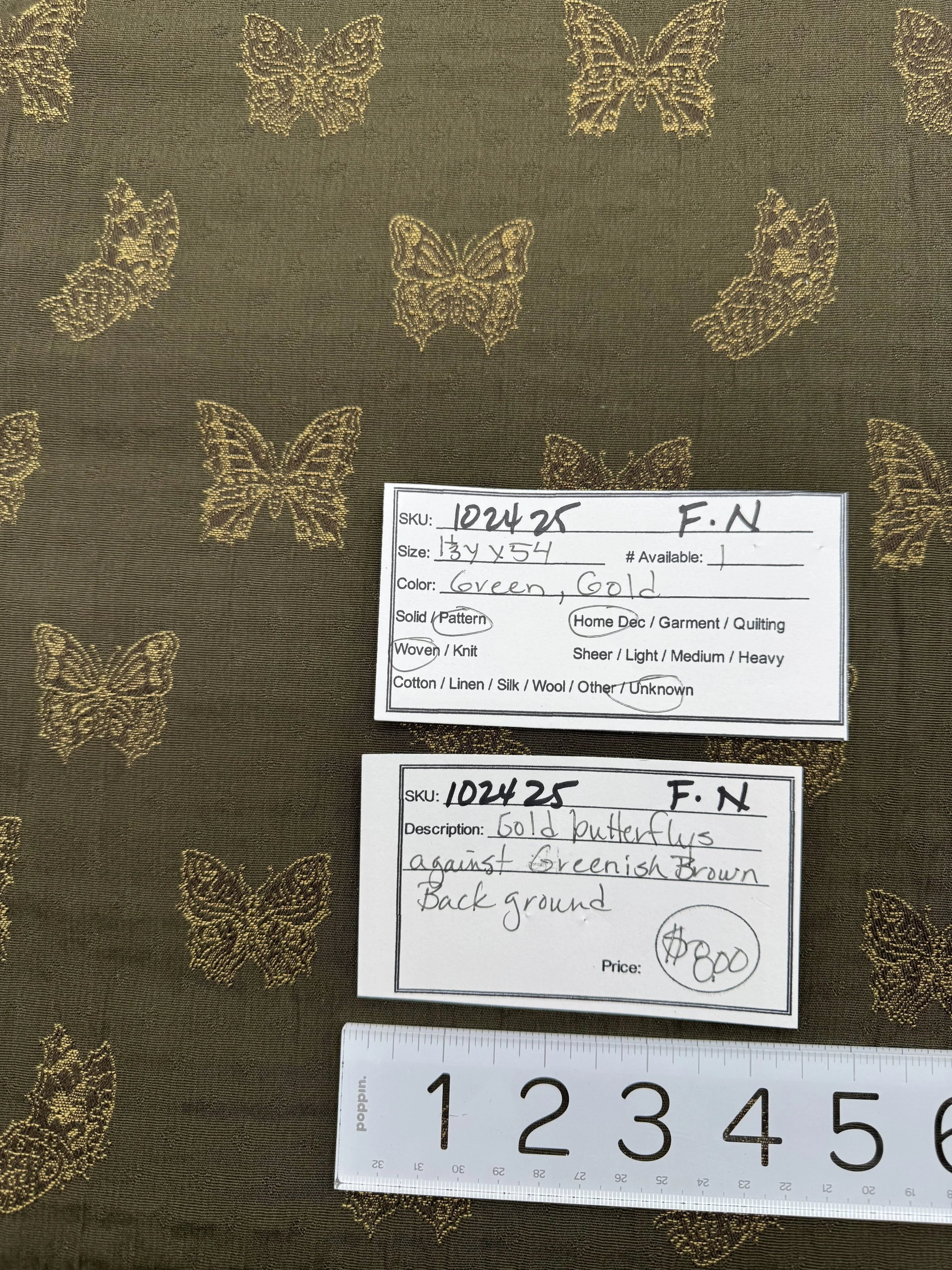102425-F-N Gold butterflies on greenish brown; 1 1/3 yds x 54"