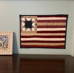 Quilted wall hanging with flag design