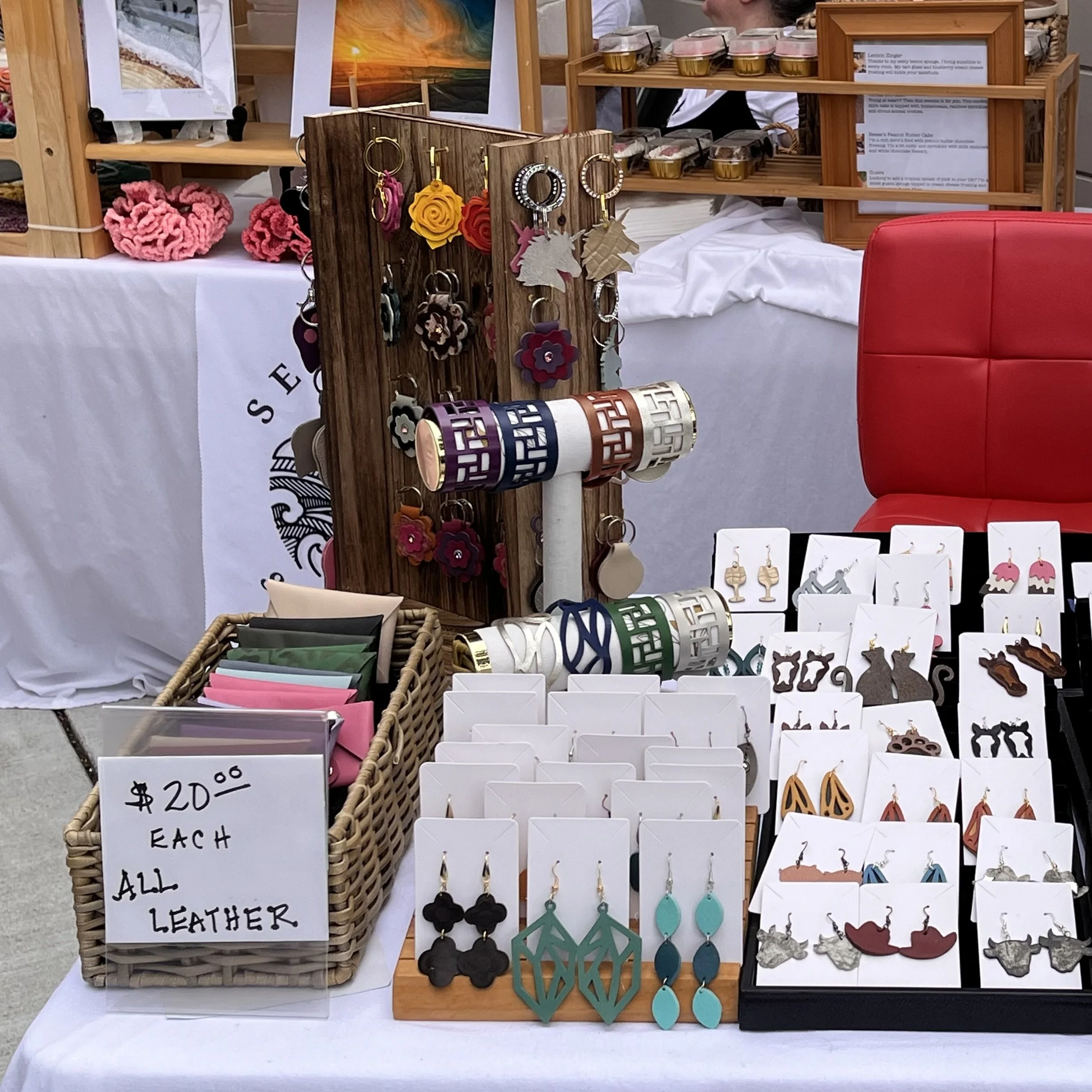 Tabletop display with leather earrings, keychains and wallets