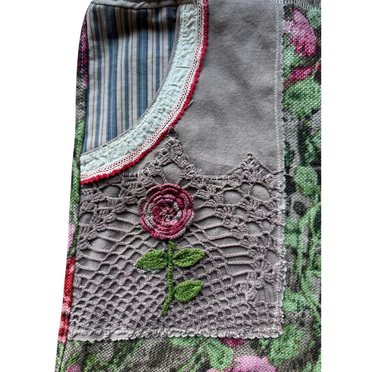 Fabric panel with lace and embroidered flower