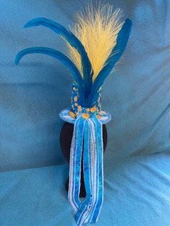 Back view of hat showing trailing ribbons and blue and yellow feathers
