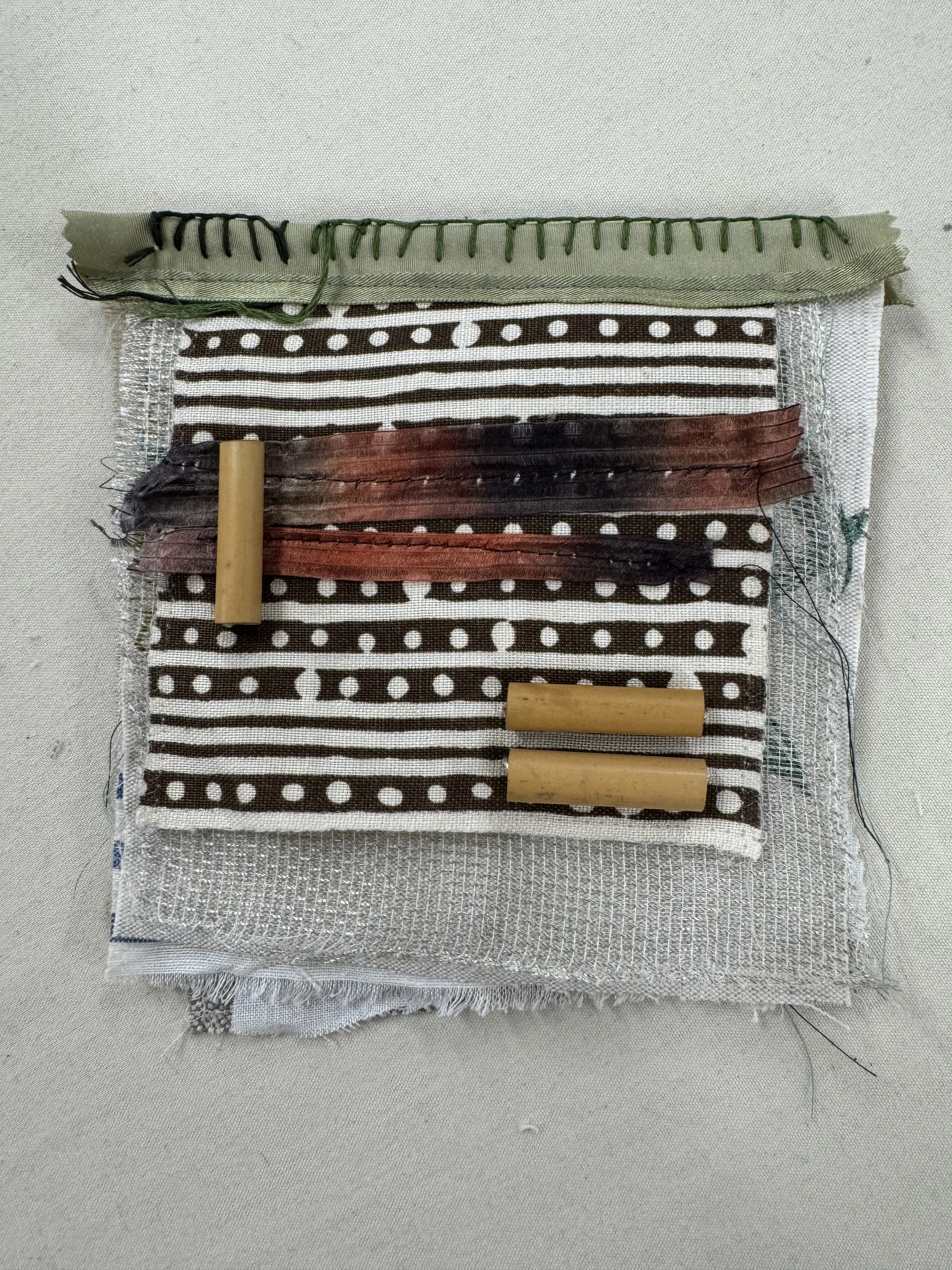 Small fabric book made with black and white striped fabric