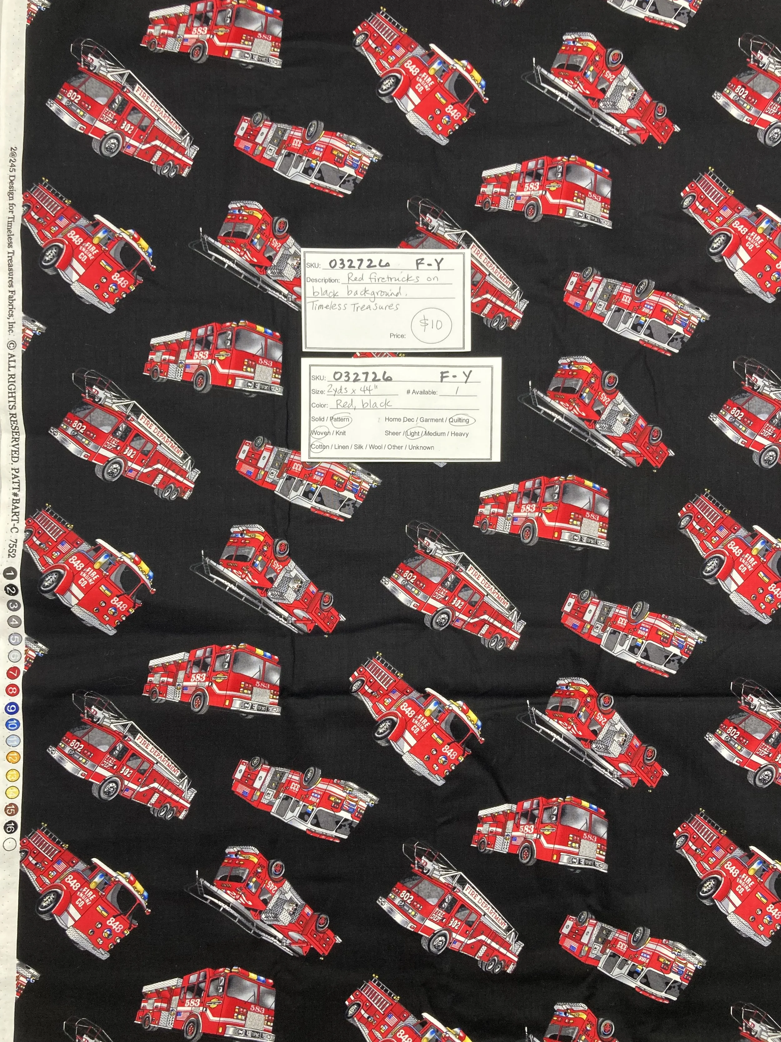 032726-F-Y Red firetrucks on black; Cotton; 2 yds x 44"