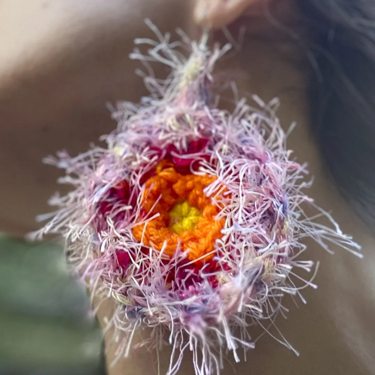 Pink, red, and orange crocheted earring