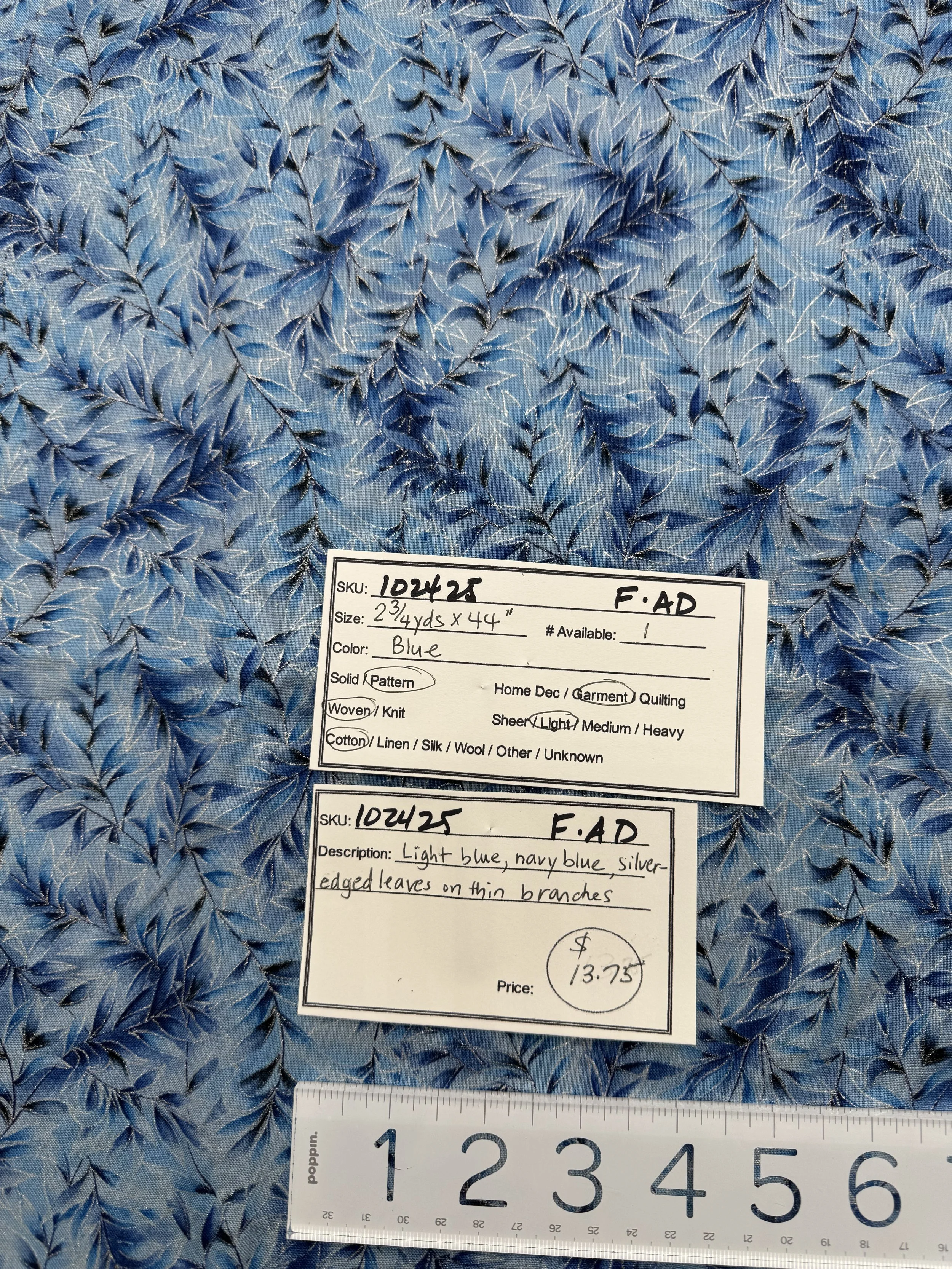 102425-F-AD blue silver-edged leaves; Cotton; 2 3/4 yds x 44"