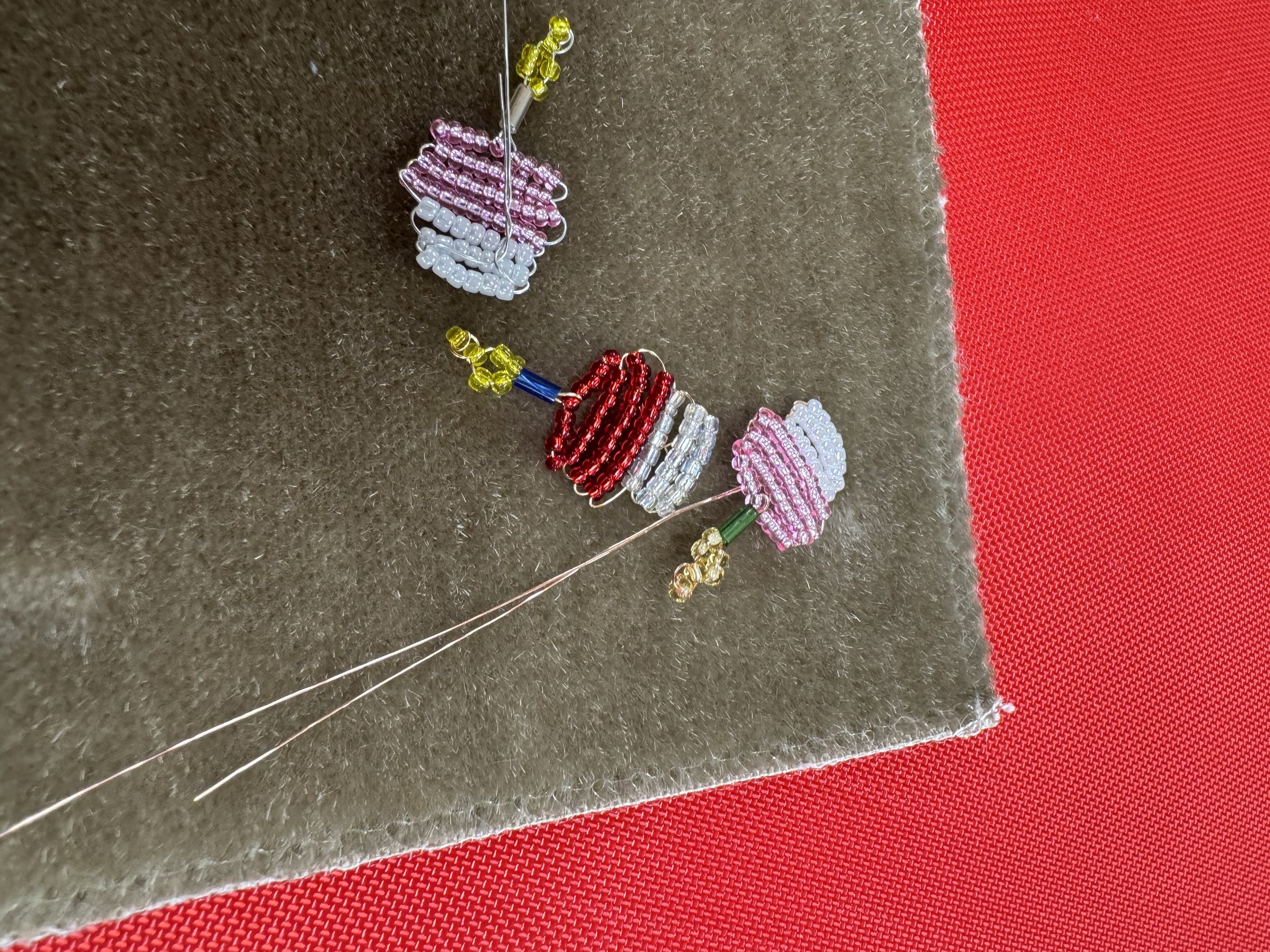 Close-up photo of beaded cupcake designs