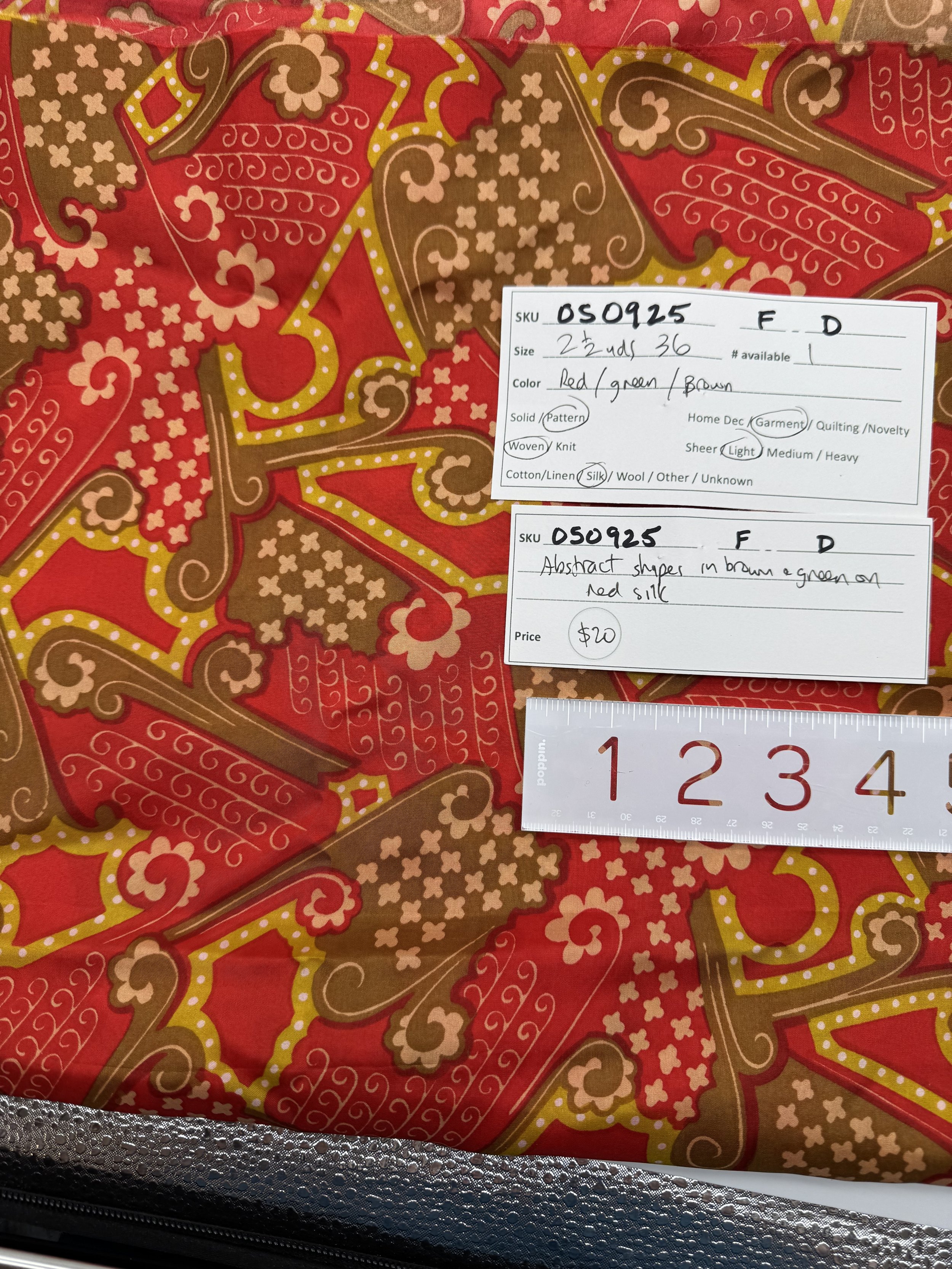 050925-F-D Abstract shapes in brown & green on red silk; 2 1/2 yd x 36"