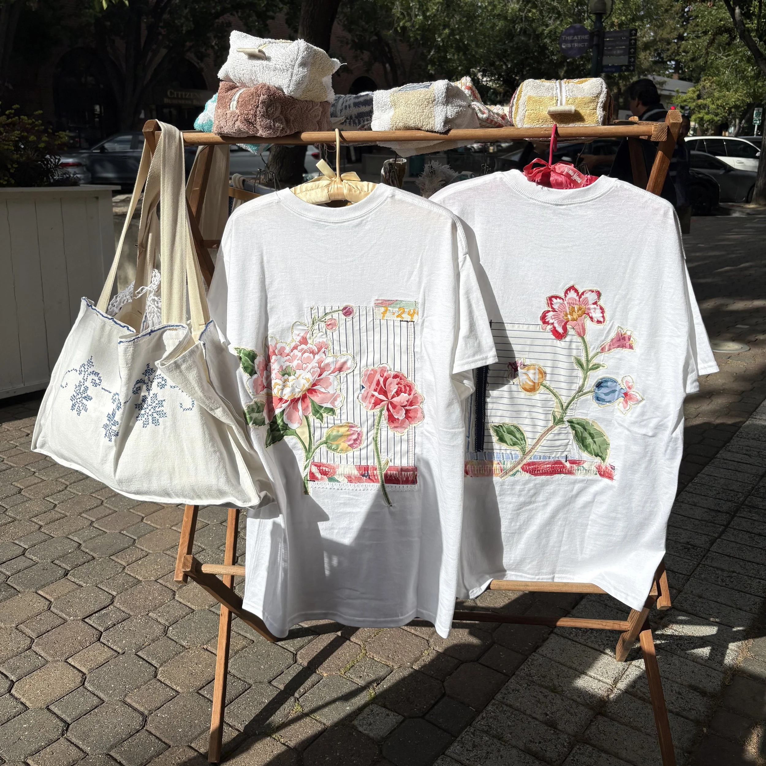 Display with T-shirts, tote bags and zipper pouches