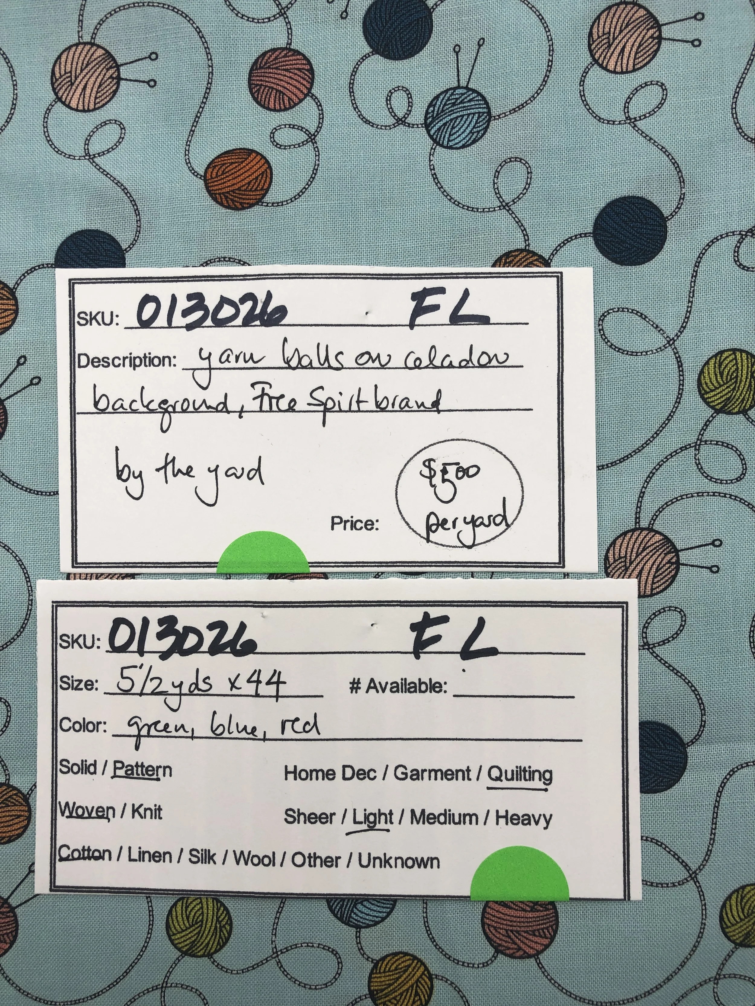 013026-F-L Yarn balls on celadon; Cotton; 44"; by the yd