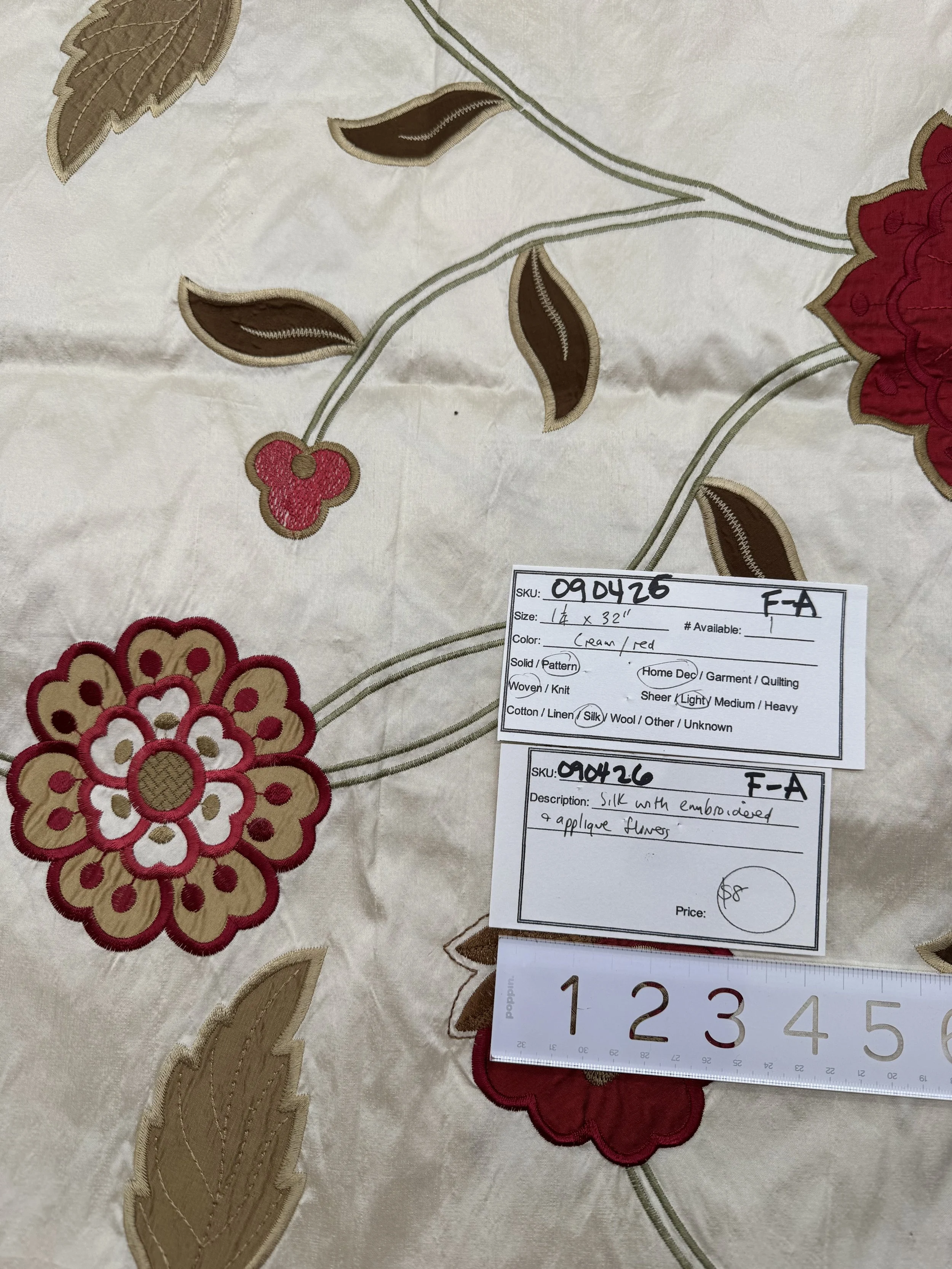 090426-F-A Silk with red embroidered appliquéd flowers on cream; 1 1/4 yd x 32"