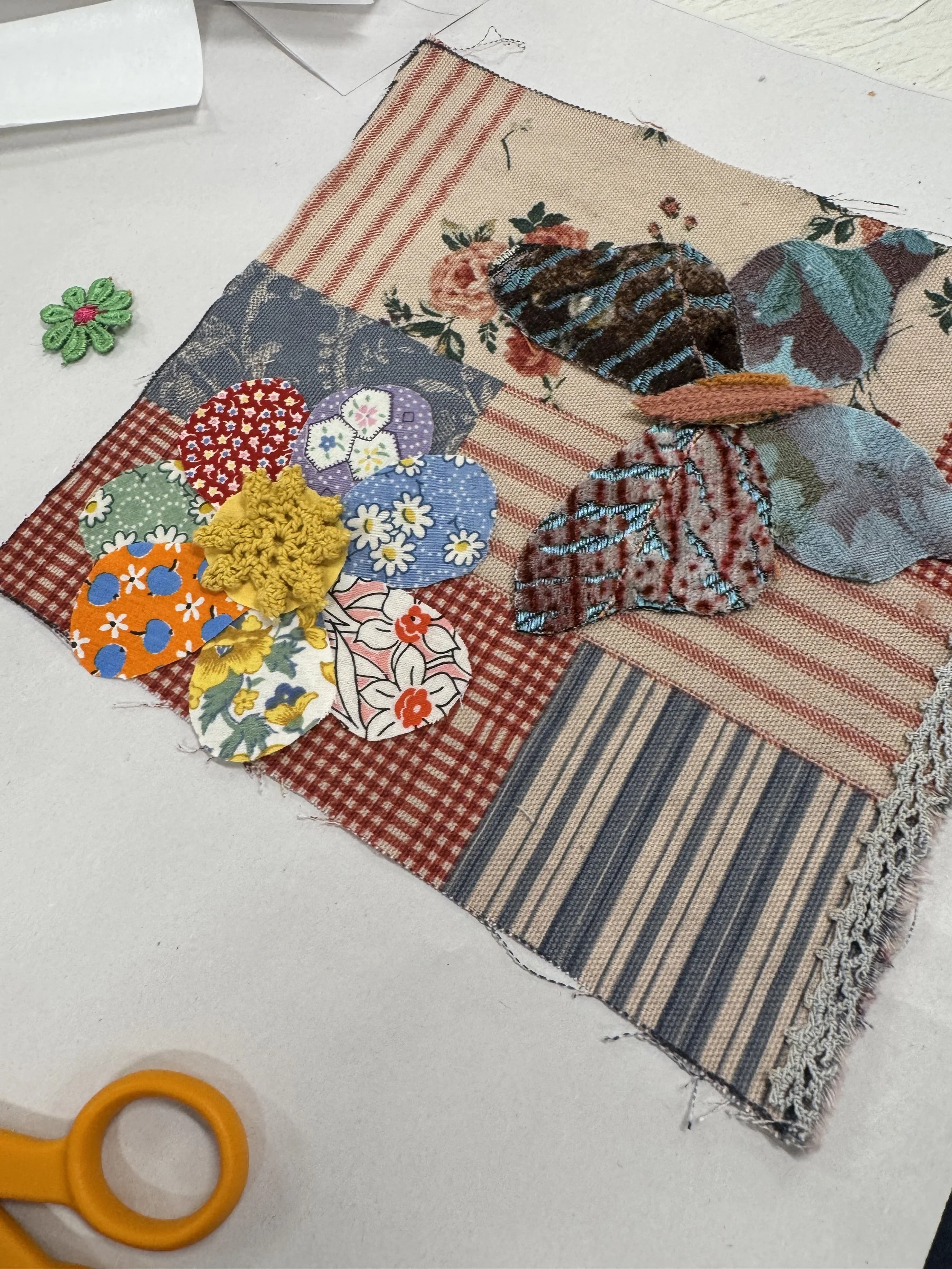 Fabric flower and butterfly appliques on patchwork square