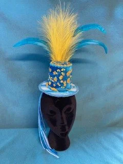Handmade hat with blue and yellow feathers