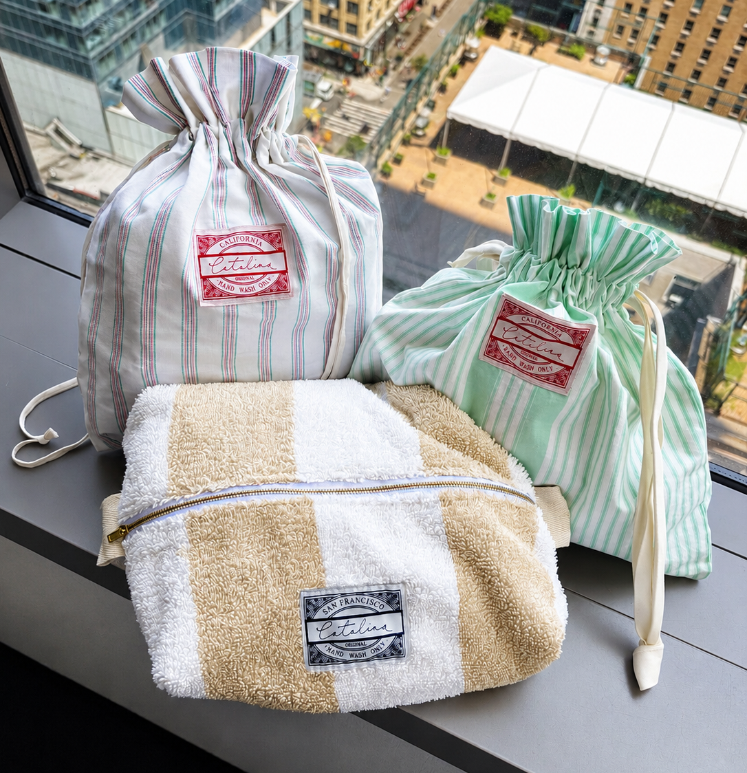 Two drawstring pouches and zipper pouch