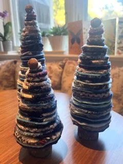 Three decorative trees made from fabric scraps