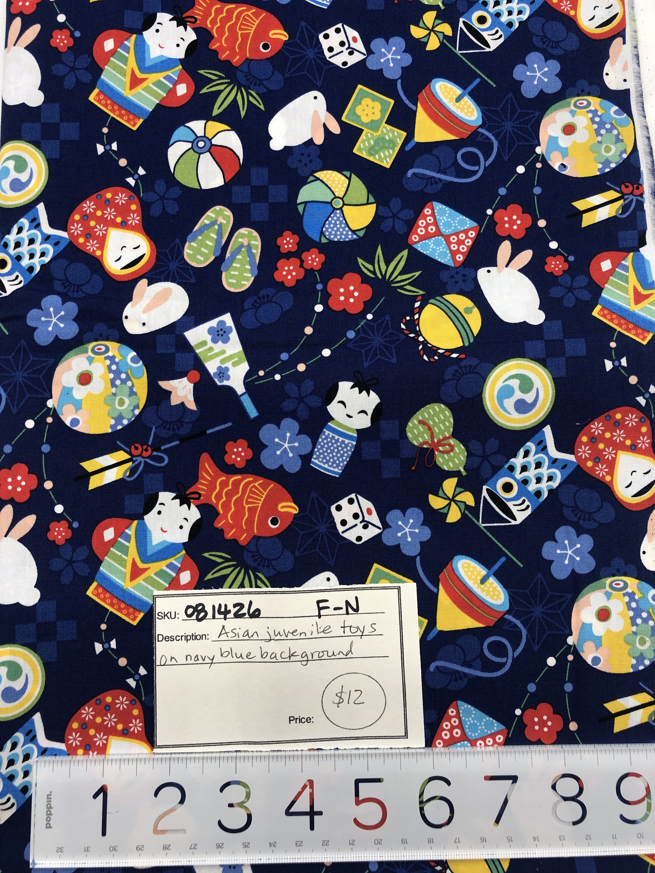 081426-F-N Asian toys on navy; Cotton; 2 yds x 44"