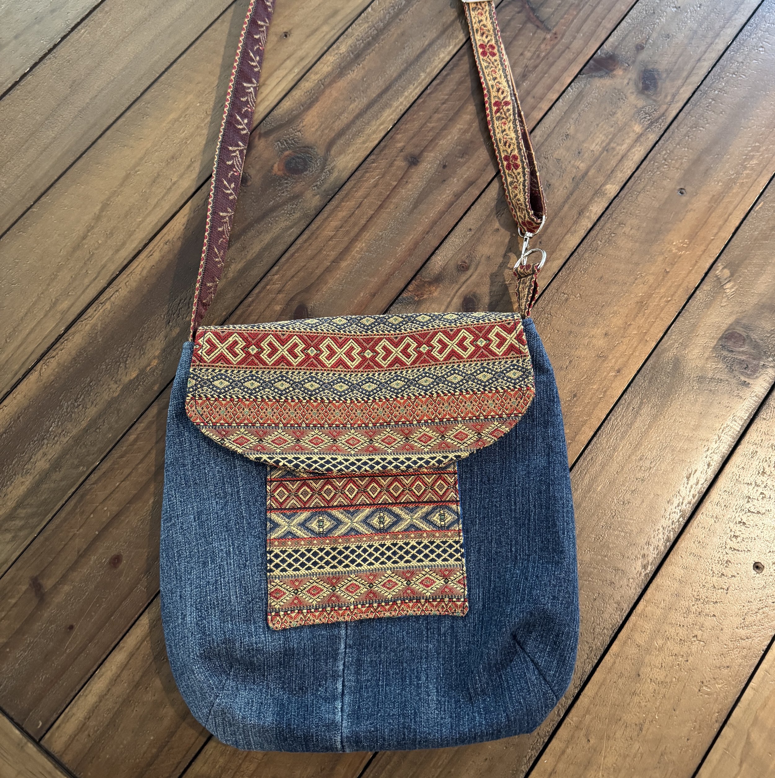 Purse made from blue denim and red patterned fabric