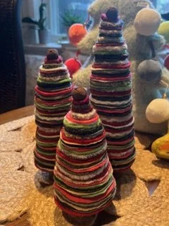 Three decorative trees made from fabric scraps